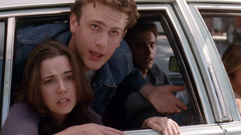 Lindsay and Nick sticking their heads out of a car window on "Freaks and Geeks" (1999-2000)