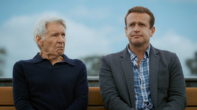 Jimmy sitting on a bench with Dr. Paul Rhoades on "Shrinking" (2023-present)