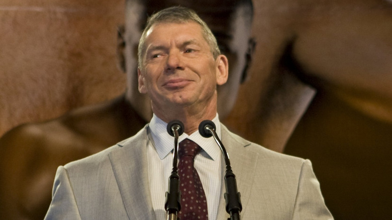 Vince McMahon speaking at a podium