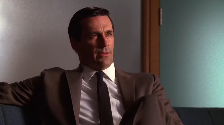 Don Draper sitting on a couch in Mad Men