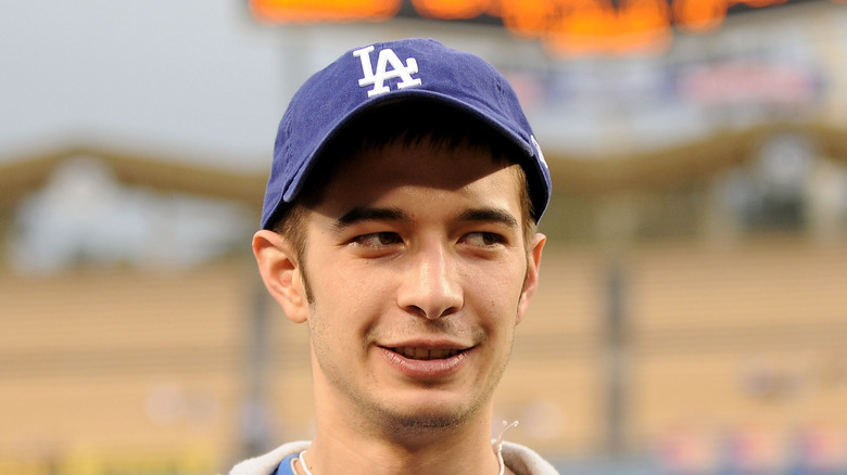 Jake Harris smiling in a baseball cap
