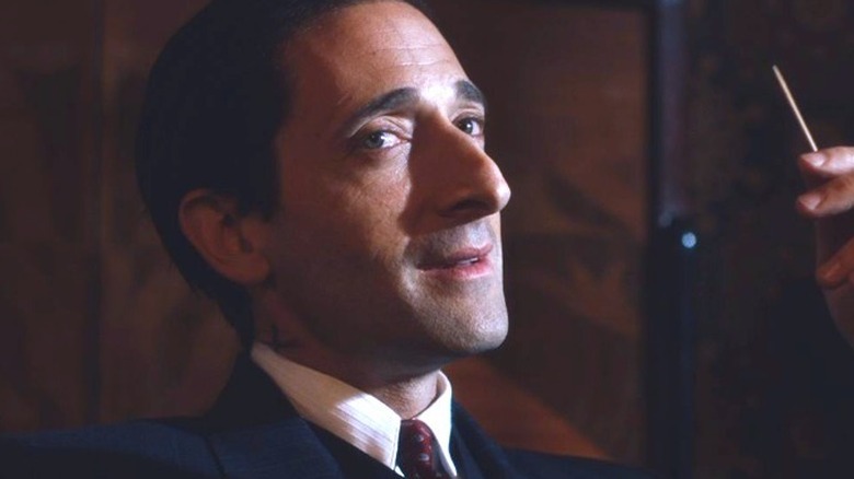 Luca Changretta holding a toothpick on "Peaky Blinders" (2013-2022)