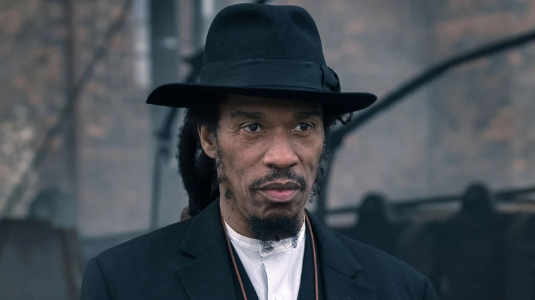 Jeremiah Jesus wearing a black hat on "Peaky Blinders" (2013-2022)