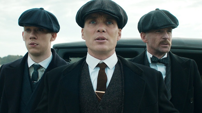 Tommy Shelby looking shocked while surrounded by family on 