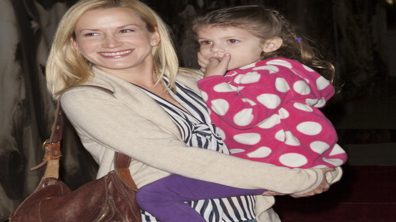 Angela Kinsey smiling with Isabel Ruby