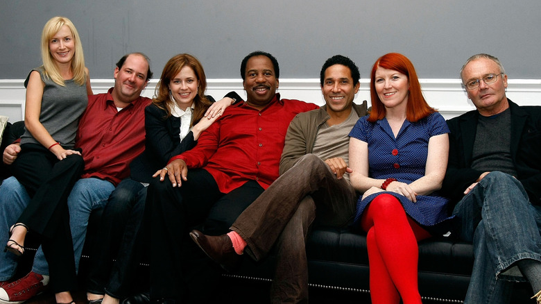 The Office cast sitting on a couch