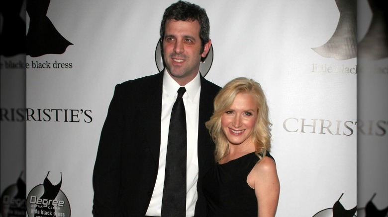 Warren Lieberstein and Angela Kinsey smiling at an event