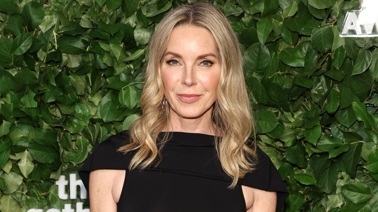 Sherri Crichton standing in front of a green background