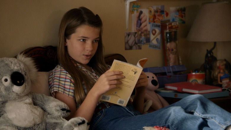Missy Cooper reading a book in bed on Young Sheldon