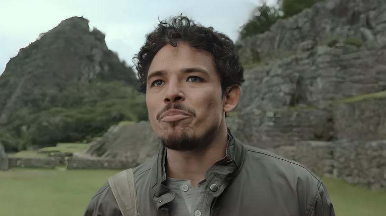 Noah Diaz stands in a mountainous area