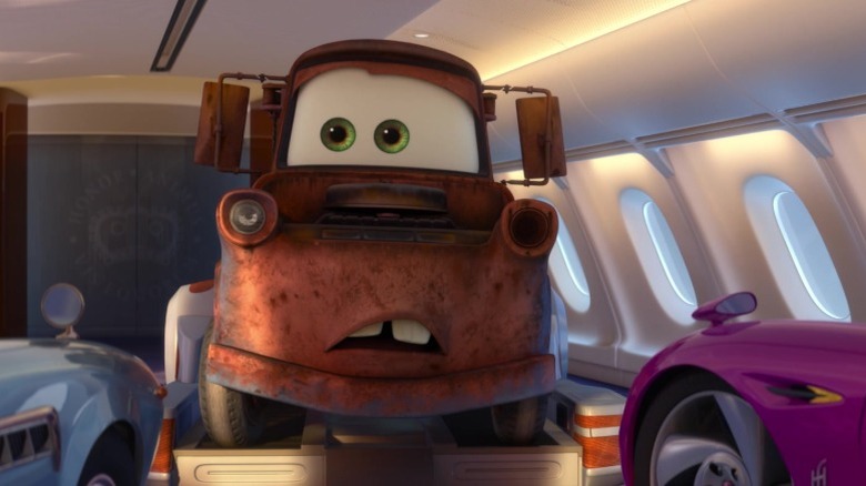 Mater inside airplane facing Finn McMissile and Holly Shiftwell in Cars 2 (2-11)
