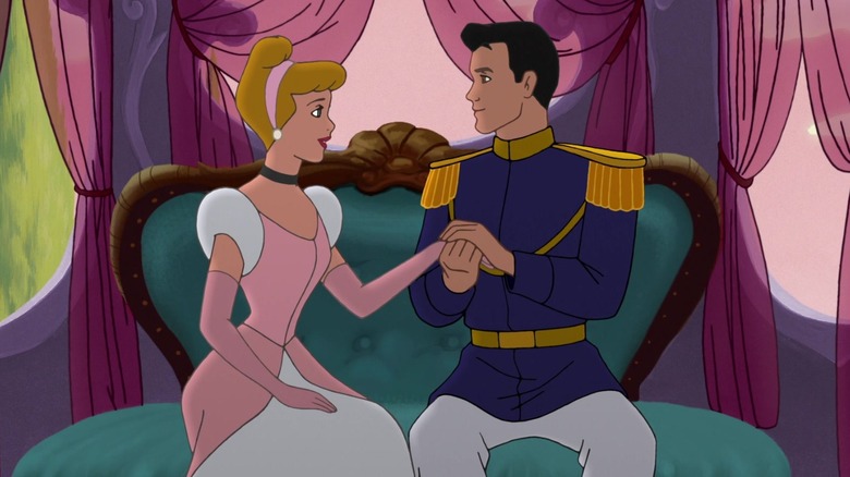 Cinderella sitting on a sofa with Prince Charming holding her hand in Cinderella II: Dreams Come True (2002)