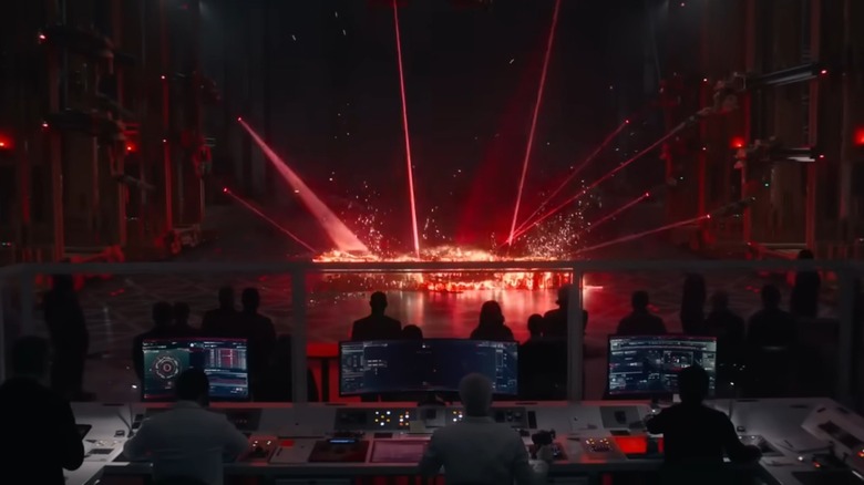A team watches lasers creating matter in "Tron: Ares" (2025)