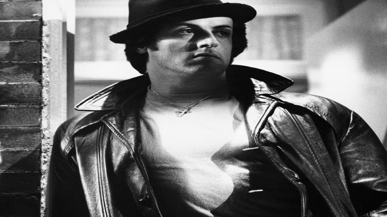 Rocky standing in doorway glaring