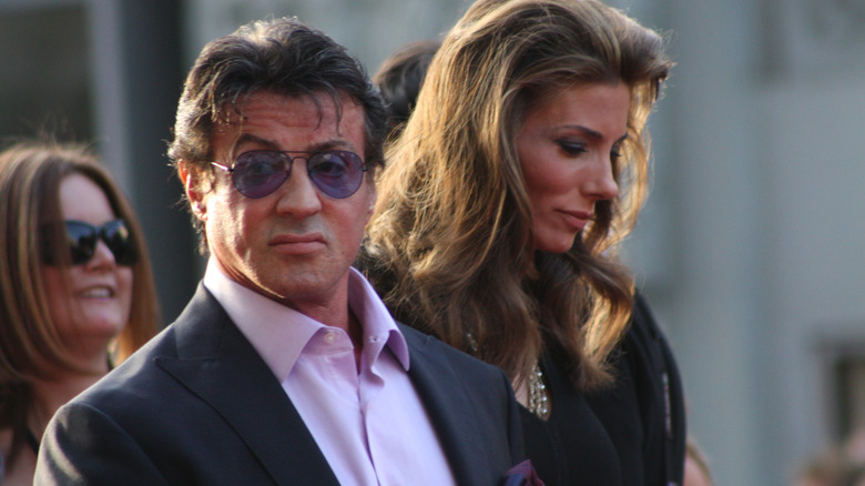 Sylvester Stallone walks with wife