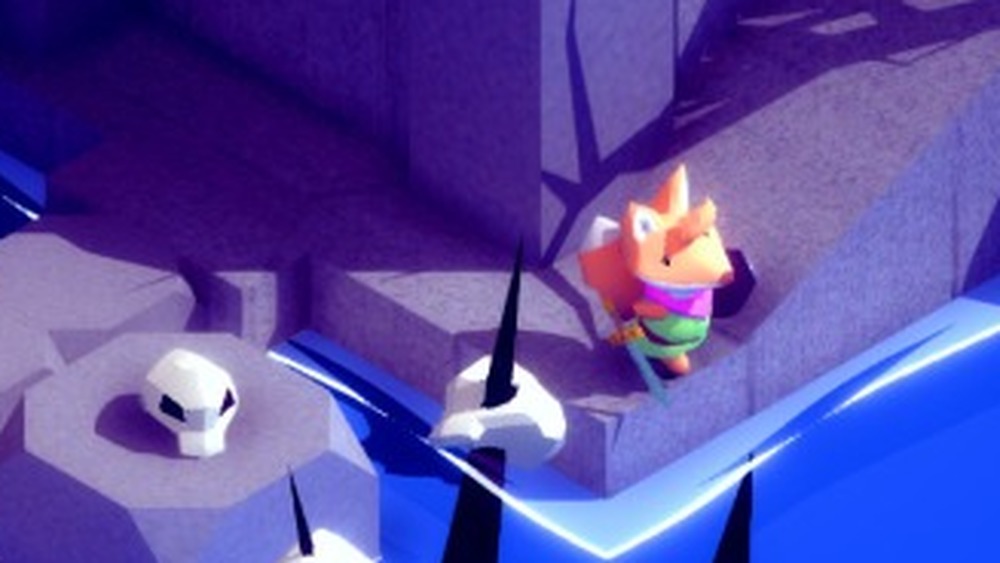 a fox stands by spikes with skulls on them