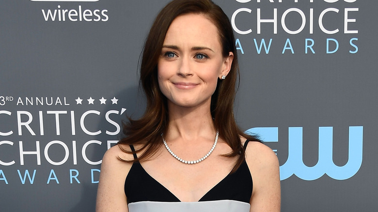 Alexis Bledel in front of gray wall