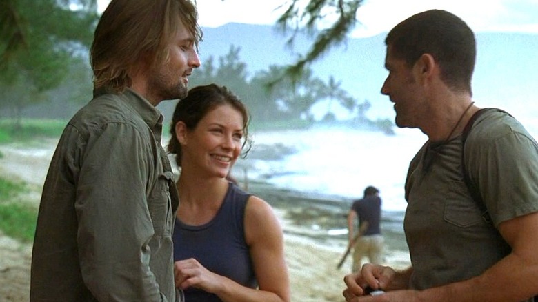Sawyer and Kate smile with Jack