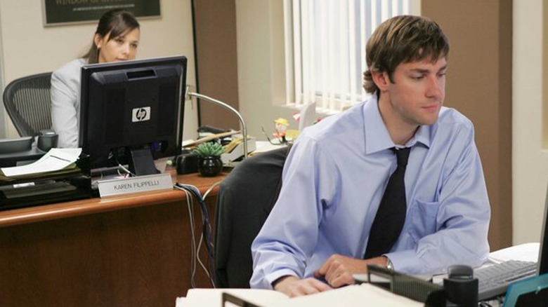 Karen watches Jim as he works