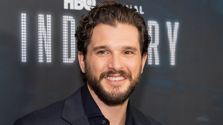 Kit Harington smiling at Industry red carpet