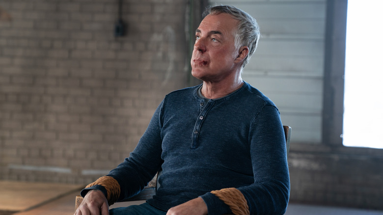 Elijah Reed smirking in "The Equalizer"