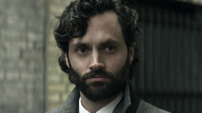 Joe standing in the street in "You"