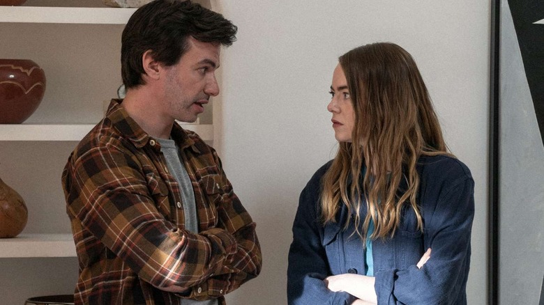 Whitney grimaces at Asher, both of their arms folded in frustration.