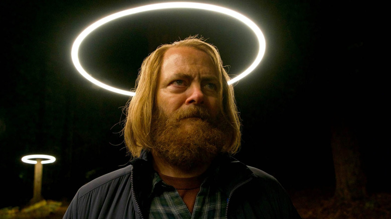 A bearded Forest stands in front of a circle of light in "Devs" (2020)
