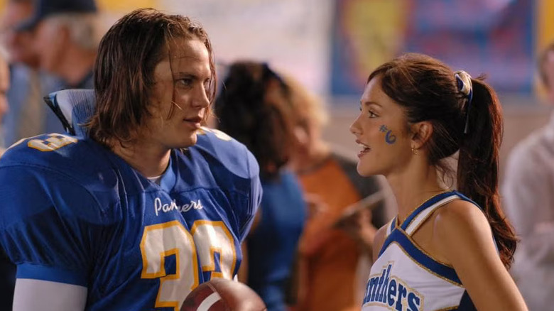Riggins and Lyla talking on the field in Friday Night Lights