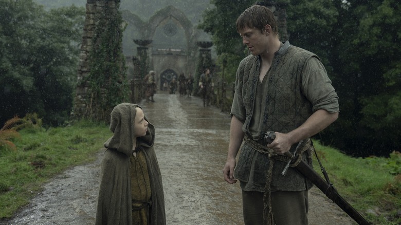 Egg and Dunk talking on a path in the rain in A Knight of the Seven Kingdoms