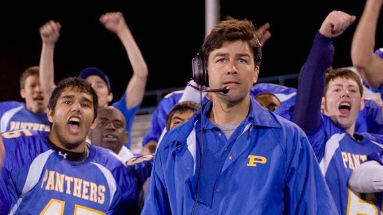 Coach Taylor in front of cheering Dillon Panthers on Friday Night Lights