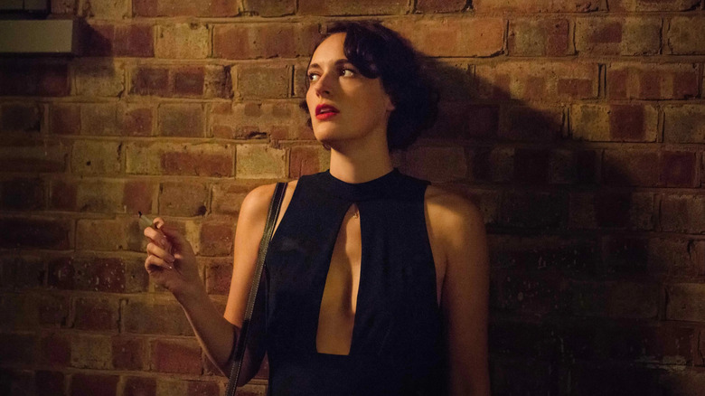 Fleabag smoking a cigarette and looking to the side in Fleabag