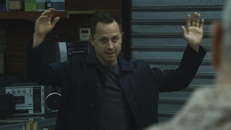 Giovanni Ribisi in Sneaky Pete with hands raised