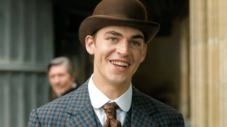 Sherlock Holmes smiling in 