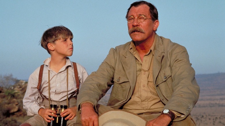 Young Indiana Jones holding some binoculars in "The Young Indiana Jones Chronicles" (1992-1996)