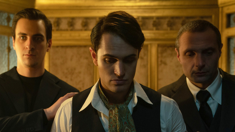 Winston held prisoner by two men