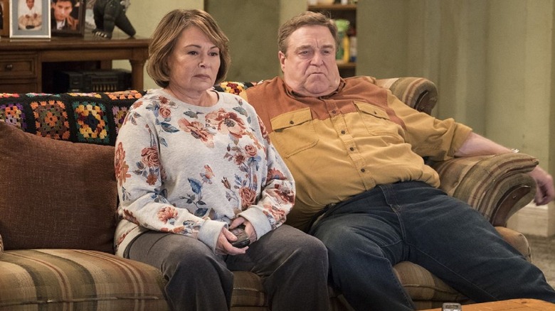 Roseanne and Dan sitting on couch