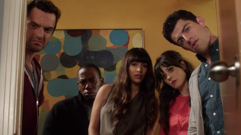 The gang looks through a door