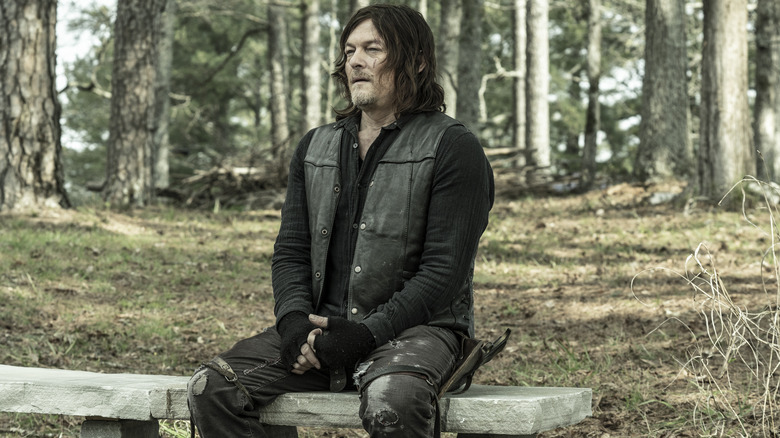 Daryl Dixon sitting on bench