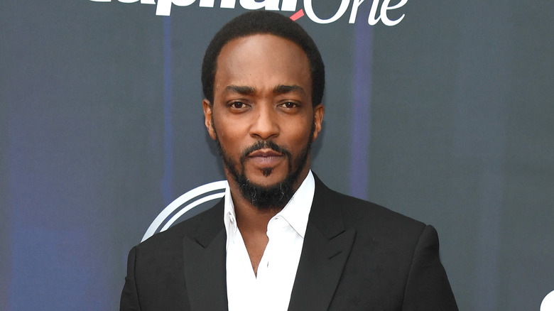 Anthony Mackie wearing black blazer over white shirt