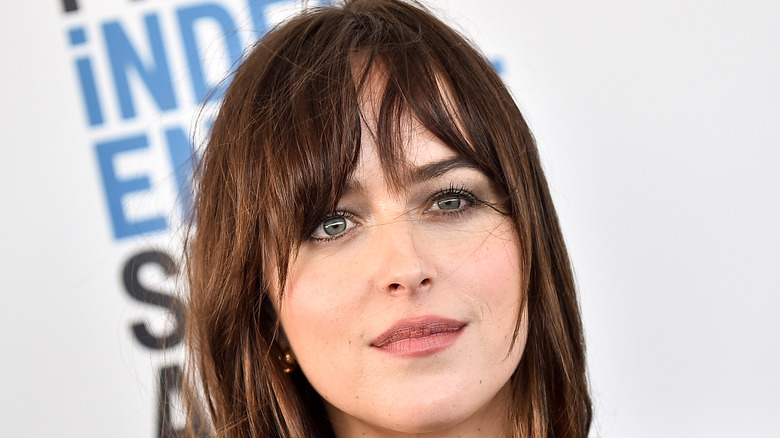 Dakota Johnson smiling on red carpet