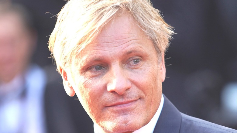 Viggo Mortensen smiling and looking sideways