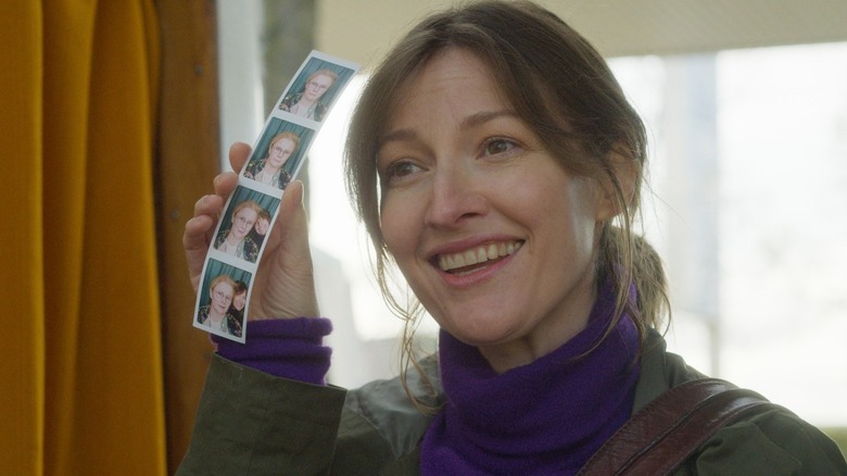 Typist Artist Pirate King's Kelly Macdonald holding photobooth photos