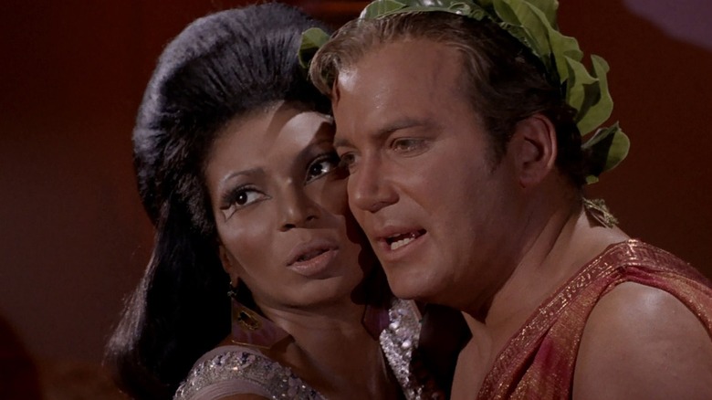 Captain Kirk and Uhura embracing on Star Trek: The Original Series  (1966 - 1969)