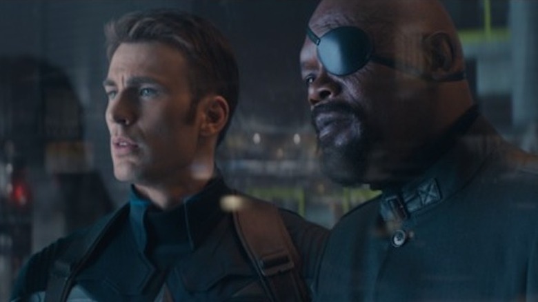 Captain America and Nick Fury look out a window