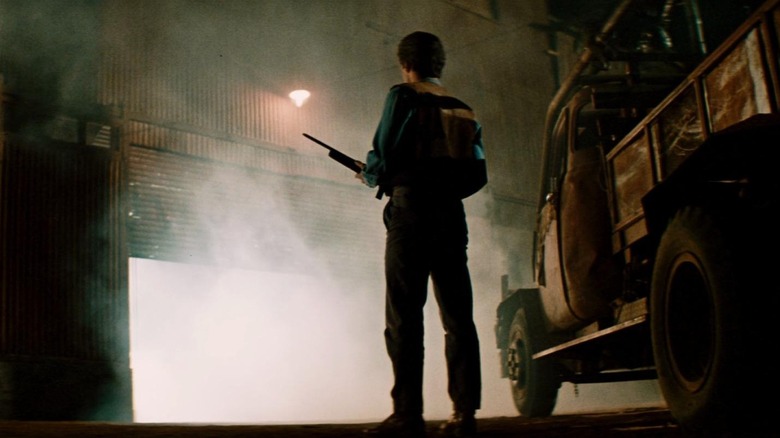 Character holds gun in Razorback