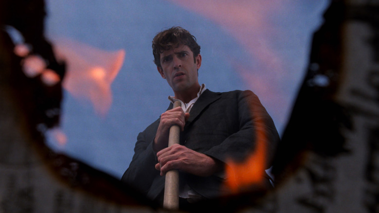 Dellamorte watches a fire