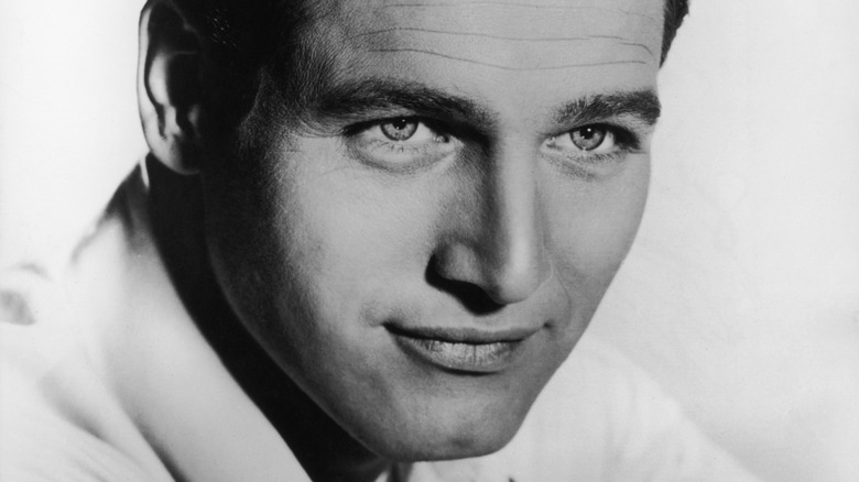 Paul Newman and Joanne Woodward grinning
