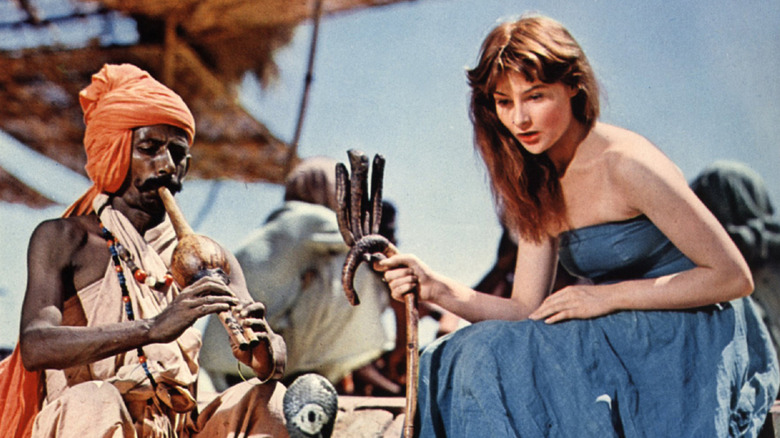 Adrienne Cori watches a snake