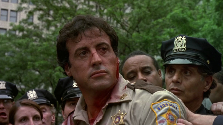 Stallone bleeding and staring